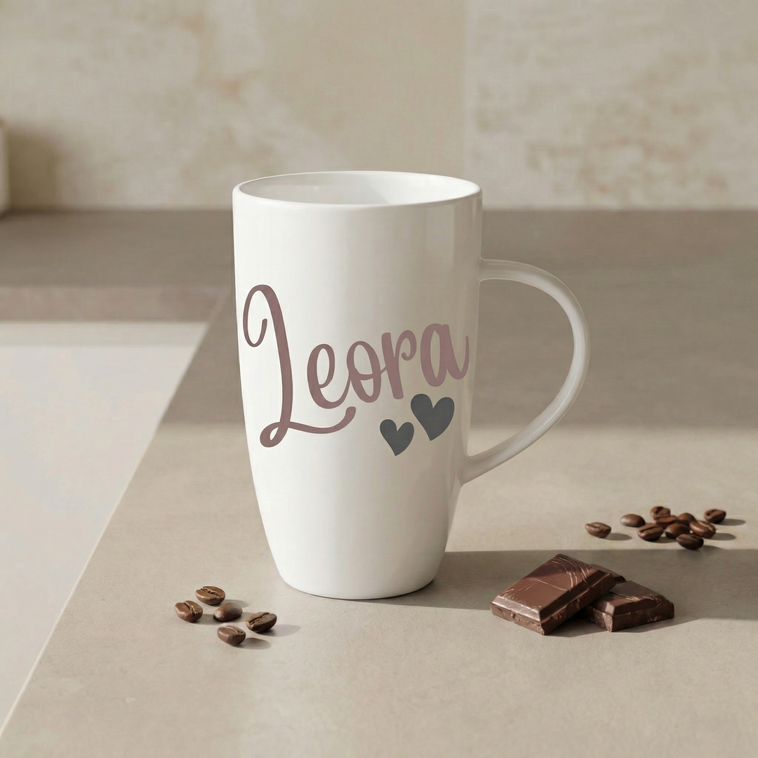 White mug with 'Leora' and heart designs on it