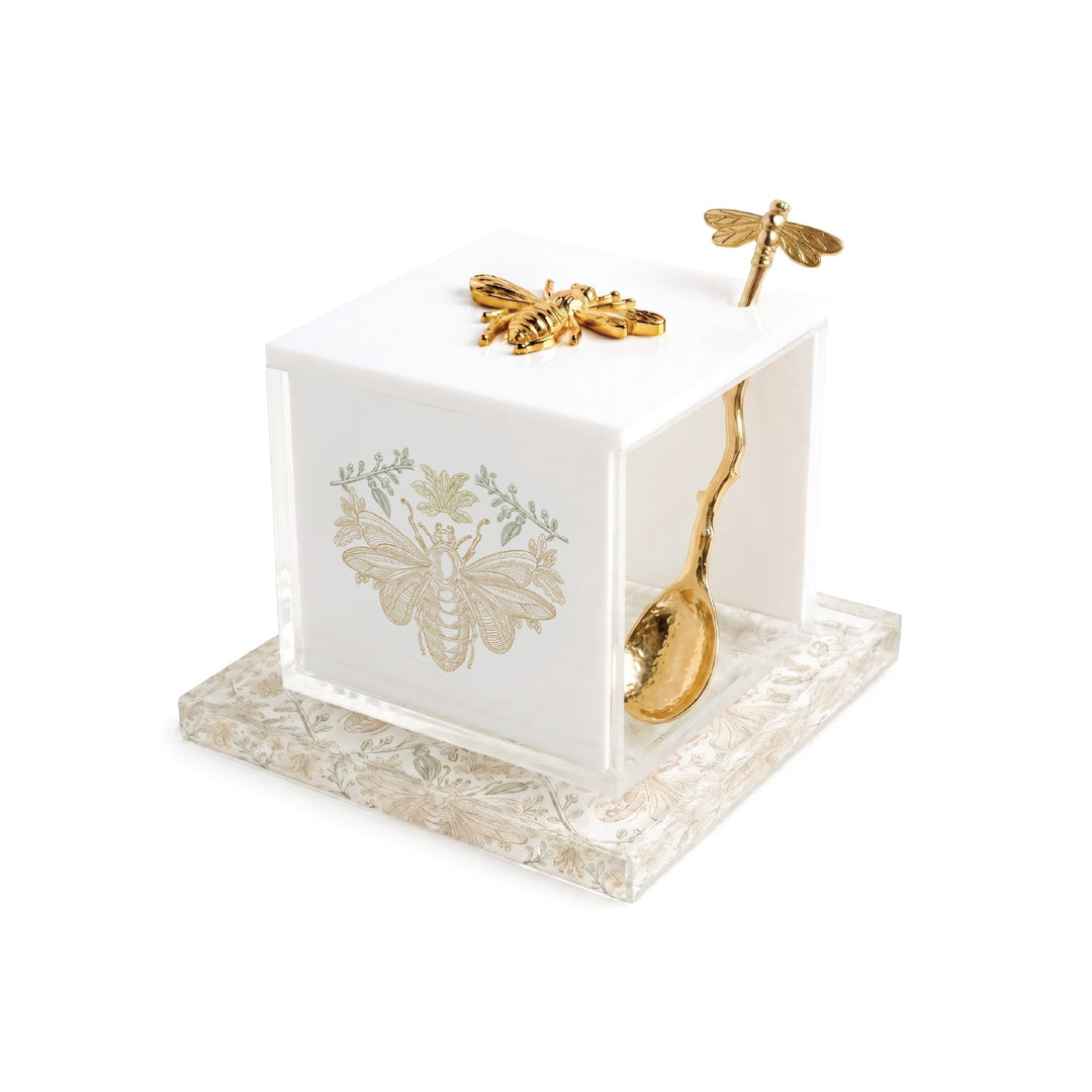 Gilded Bee marble and lucite honey dish with gold bee detailing, angled view